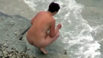 she is peeing in the water near the beach, , PissRIP